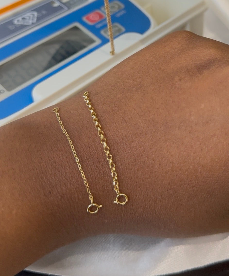 Gold bracelet on a wrist with a blurred background