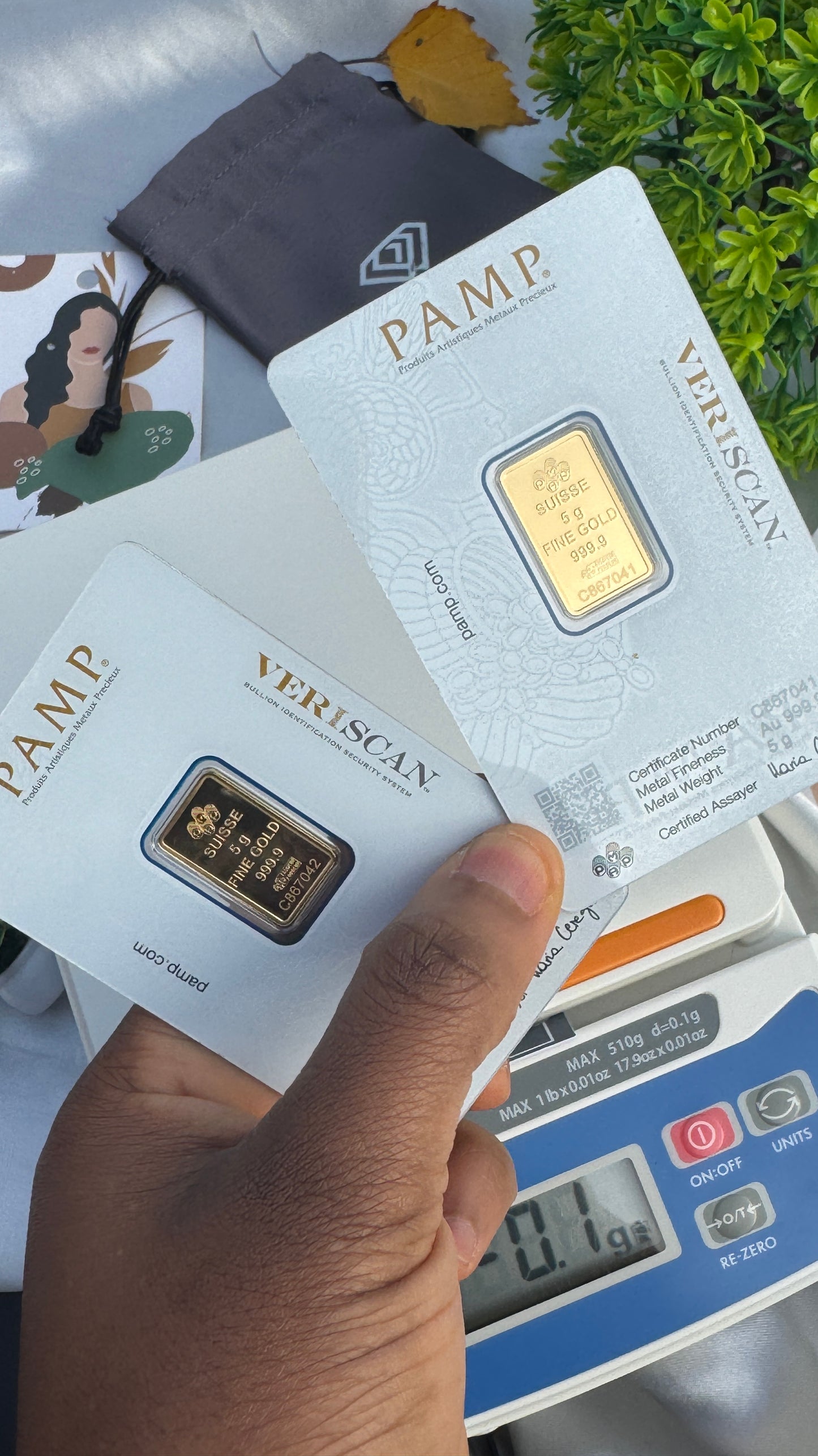 Gold bars in PAMP packaging with a digital scale in the background